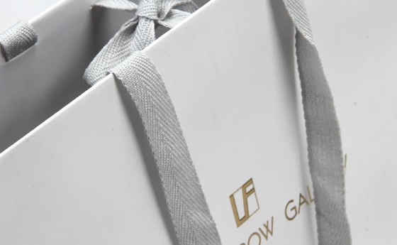 Witte gepersonaliseerde papieren tassen High-end brillen Winkelen papieren tassen